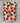 Plaid in lana cotta piegato, con fantasia fiorita e sfondo beige 